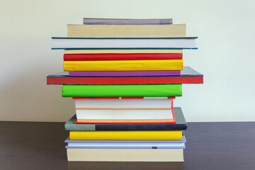 School concept. Stack of  different books on table. Copy space