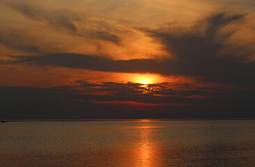 Evening sun over the tropical sea with waves. Nature background