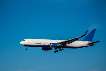 airplane prepares for landing with extended landing gear