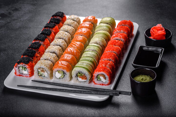Delicious fresh rolls in various sets. Japanese food with avocado, shrimp, crab and salmon