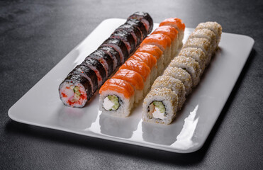 Delicious fresh rolls in various sets. Japanese food with avocado, shrimp, crab and salmon