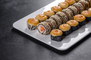 Delicious fresh rolls in various sets. Japanese food with avocado, shrimp, crab and salmon