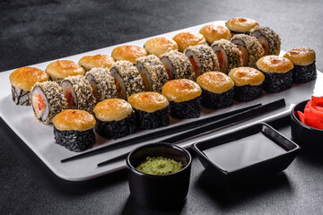 Delicious fresh rolls in various sets. Japanese food with avocado, shrimp, crab and salmon