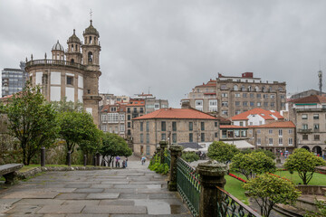 Obraz premium Crossing a stone bridge in the old town of Pontevedra on a typical day on the Galician Atlantic Riviera.