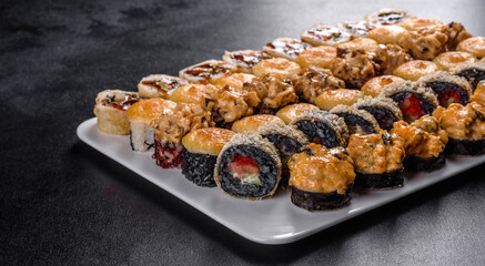 Delicious fresh rolls in various sets. Japanese food with avocado, shrimp, crab and salmon