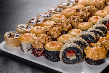 Delicious fresh rolls in various sets. Japanese food with avocado, shrimp, crab and salmon