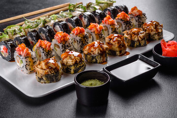 Delicious fresh rolls in various sets. Japanese food with avocado, shrimp, crab and salmon