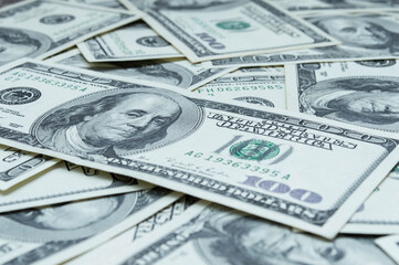 One hundred US dollars banknotes. Cash one hundred dollar bills, 100 dollars, Benjamin Franklin portrait, american currency exchange finance. Pile of hundred US dollars