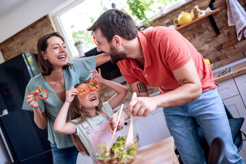 Happy family cook at home in the kitchen