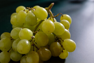Close up of grape with green grapes isolated on green background