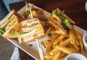 Table with food and club sandwich