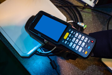 Terminal for data collection. Warehouse equipment concept. Device for scanning barcode. Terminal for data collection with screen off. Laser terminal data collection. Departure registration device