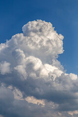large cumulus white cloud against blue sky