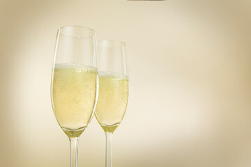 Champagne glasses. The second glass is a little bit blurred.