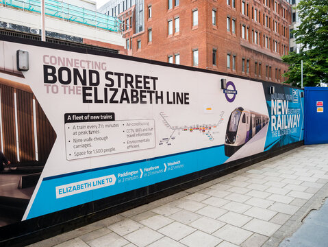 London, UK, July 10th 2021: Near Bond Street, an information hoarding. A new railway under construction by Crossrail. Building a new rail line for London East to West, The Elizabeth Line. Travel.