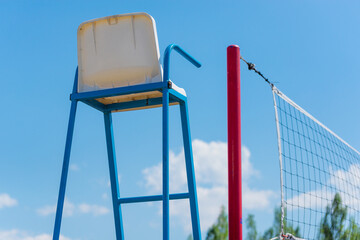The judge's chair near the volleyball net.