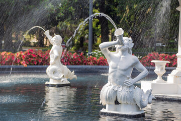 Close-up of water spurting from the nymph fountain in Forsyth Park, Savannah, Georgia. - obrazy, fototapety, plakaty