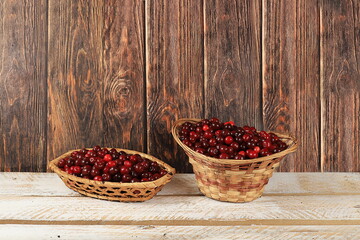 Harvesting in august, cherries on wooden background, rustic style, healthy natural food concept, store advertisement, business card for cafe, invitation with place for text