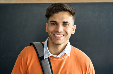 Portrait of young happy smiling Indian latin Hispanic high school college university student...