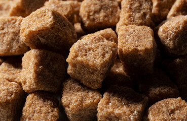 Brown cane sugar cubes all over the screen.