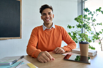 Young happy cheerful Indian latin student gen z having virtual call video conference chat remotely with teacher looking at web camera. Education technologies concept. Webcam view portrait. - obrazy, fototapety, plakaty