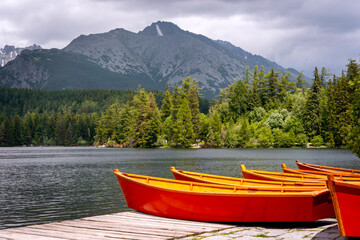 Red boats by Štrbské Pleso in High Tatras, mountains lake nature, Vysoké Tatry, Slovakia