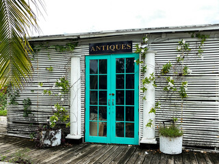 Old abandoned antique shop with teal doors