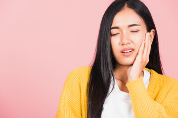 beautiful young woman suffering from toothache