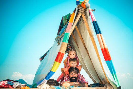 Summer family vacation. Happy father with chidren camping. Fathers day.