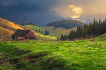 Fototapeta na wymiar Fantastic alpine place with misty mountains at sunrise, Transylvania, Romania