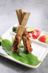 Sate Lilit, Traditional Balinese Minced Seafood or Chicken Satay with Bamboo Skewer. Sometimes...