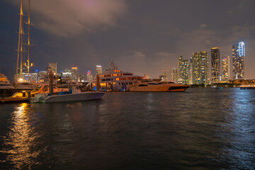 Miami city. Miami skyline panorama at dusk with skyscrapers over sea. Night downtown sanset.