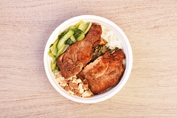 Taiwanese  chicken drumstick bento on wooden table