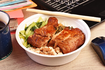 Taiwanese  chicken drumstick bento on wooden table