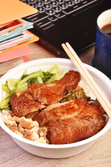Taiwanese  chicken drumstick bento on wooden table