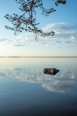 The mirror-like water surface of Lake Onega in Karelia