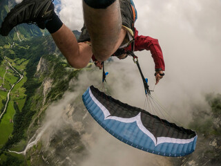 extreme paraglider point of view in Swiss alps