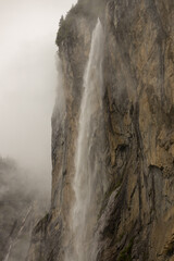 Waterfall in Lauterbrunnen city at cloudy day 