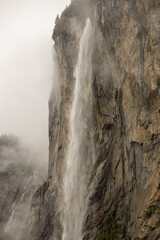 Waterfall in Lauterbrunnen city at cloudy day 