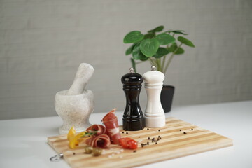 meat and spices on cutting board