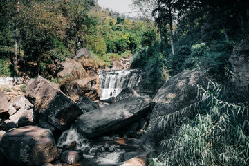 Beautiful Ramboda falls, cascade water stream, and the rocks. Natural waterfall landscape.