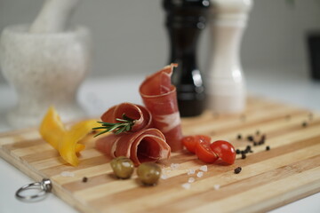 Fototapeta na wymiar Salt and pepper with meat on a plate