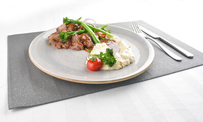 grilled juicy wagyu beef tenderloin or sirloin steak in brown sauce with egg mayo potato and asparagus vegetables western halal menu