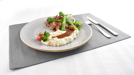 grilled juicy wagyu beef tenderloin or sirloin steak in brown sauce with egg mayo potato and asparagus vegetables western halal menu