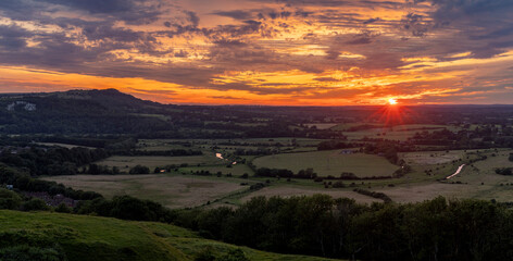 Naklejka na ściany i meble July sunset from Malling Down near Lewes on the South Downs, East Sussex, south east England