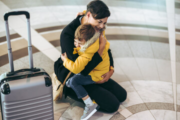 Mother getting emotional with her child at airport