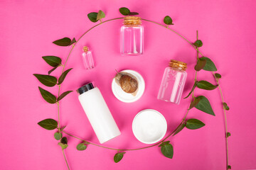 set of natural cosmetics from snail mucin, kit skin care product on pink background
