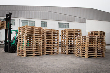 Stack of Wooden Pallets Rack at Storage Warehouse.	