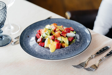 Natural and delicious tuna salad with tomatoes poured with cream sauce close-up. Healthy food is good for your health.