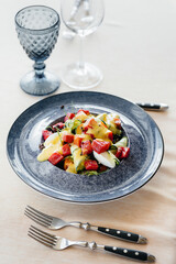 Natural and delicious tuna salad with tomatoes poured with cream sauce close-up. Healthy food is good for your health.